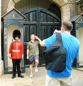 A man on one of Richard's tours marching alongside a guard at St James's Palace.