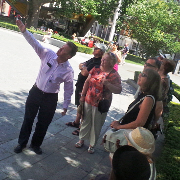 Tour guide Richard Jones showing a group St Paul's Cathedral.