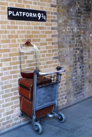 The trolley embedded in the wall at Platform nine and three quarters at King's Cross Station.