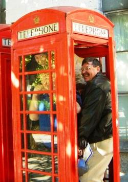 A group of people cramming into a phone box on Richard's Harry Potter Tour.